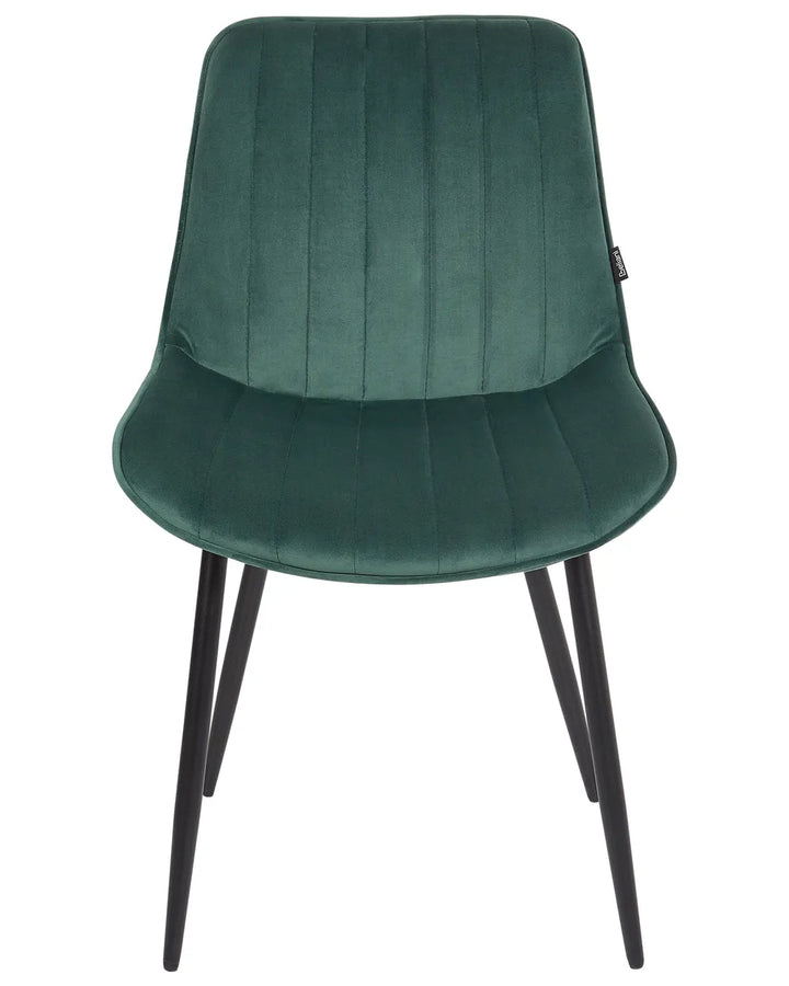Green velvet dining chair with vertical channel stitching, a gently curved seat, and slim black metal legs, blending comfort with modern elegance.