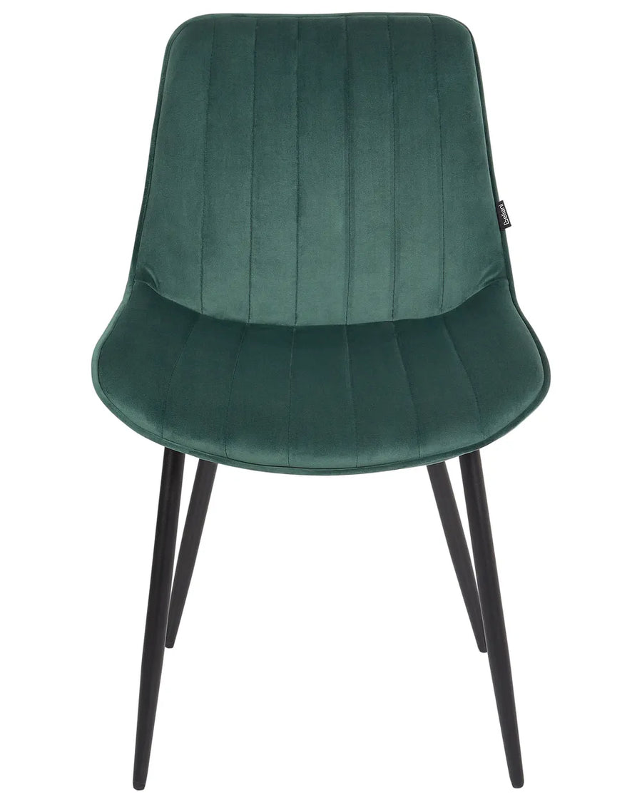 Green velvet dining chair with vertical channel stitching, a gently curved seat, and slim black metal legs, blending comfort with modern elegance.