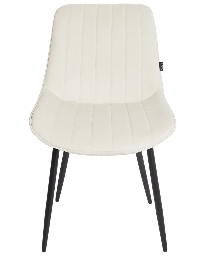 Light beige faux leather dining chair with vertical stitched detailing, a sleek curved silhouette, and black metal legs for a clean, modern look.