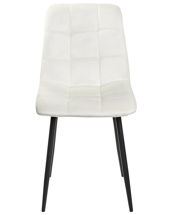 Modern dining chair featuring soft white upholstery with stitched square tufting and sleek black metal legs, offering a clean and contemporary look.