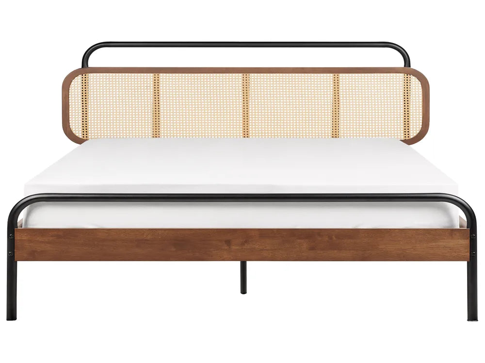 Bed with wooden and rattan headboard on a white background
