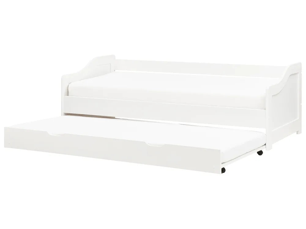 White crib with mattress on a white background