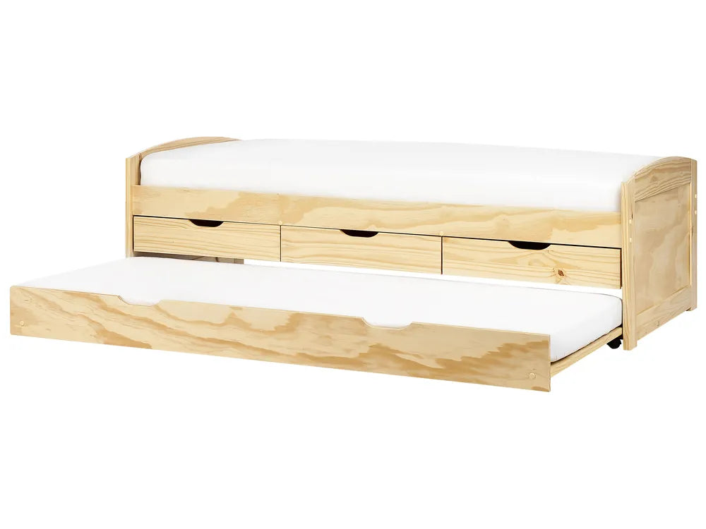 Wooden bed with white mattress and drawers on a white background