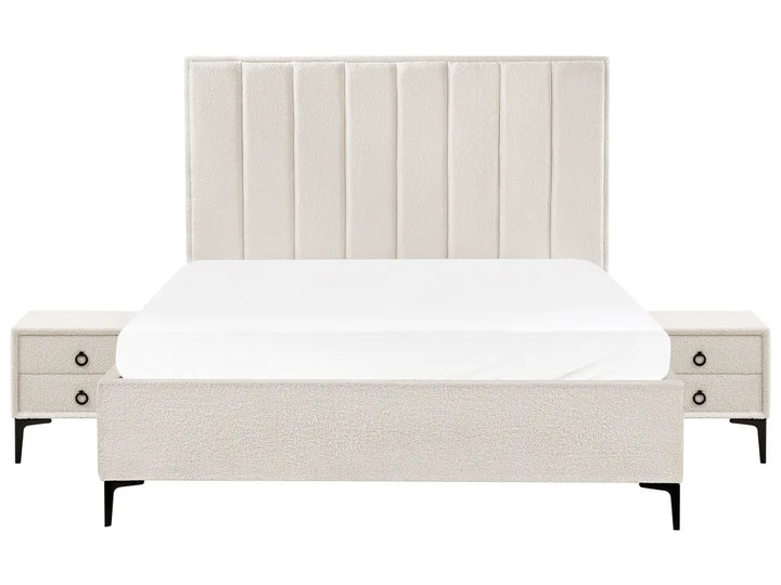 Beige upholstered bed with matching nightstands 