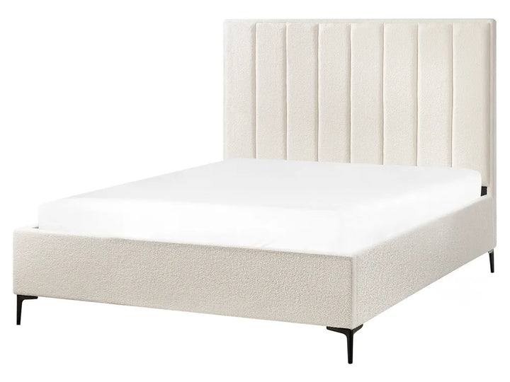 Beige upholstered bed with tufted headboard 