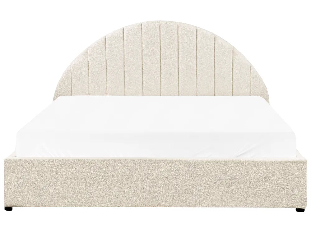 Beige bed with white bedding on a white background