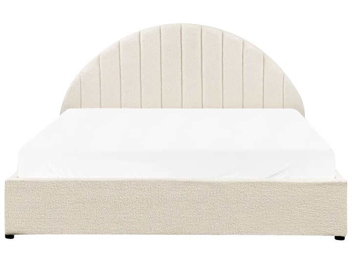 Beige bed with white bedding on a white background