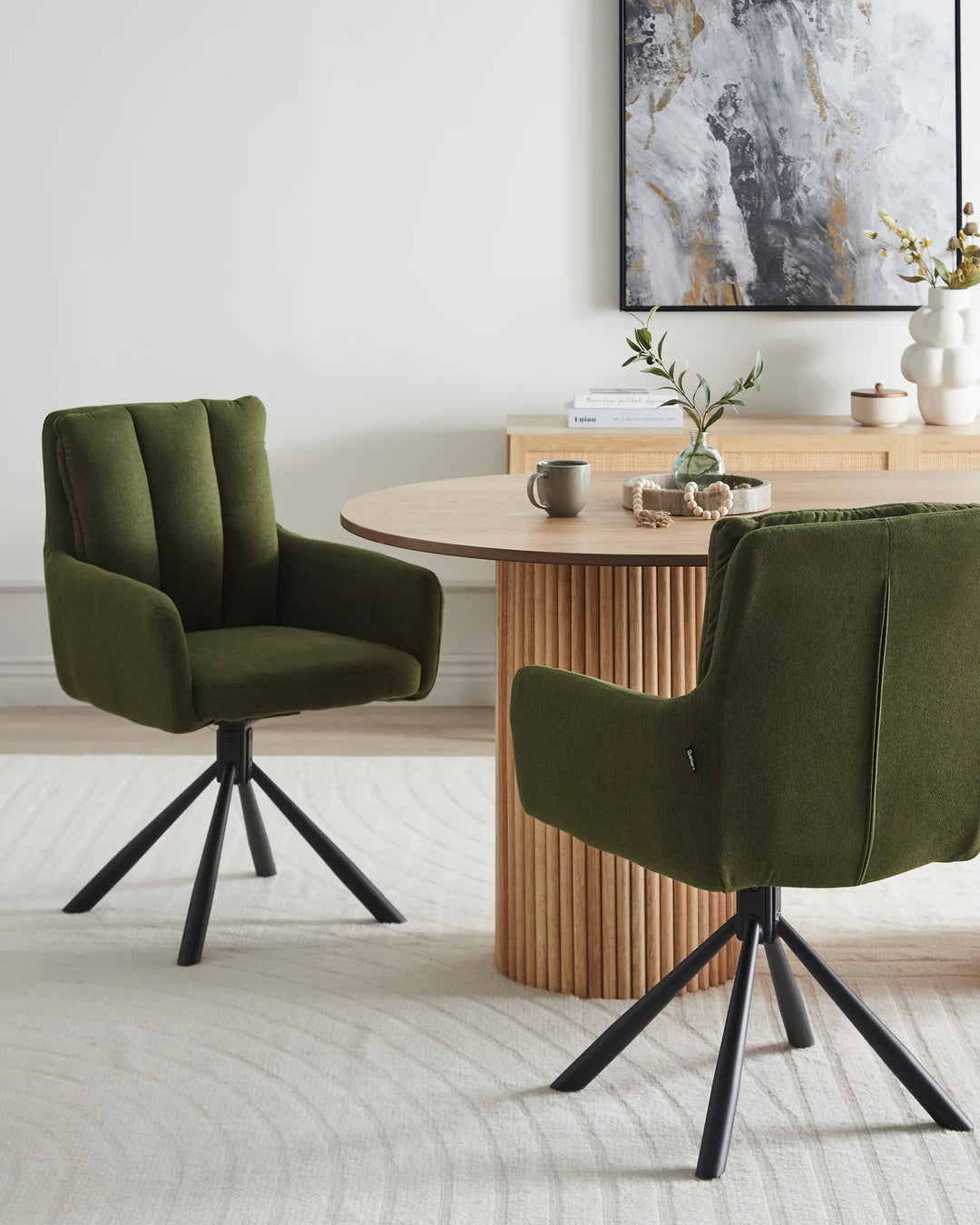 Green swivel dining chair styled around a modern wood dining table in a warm contemporary interior.