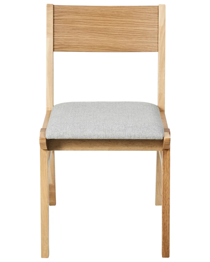 Modern dining chair crafted from natural wood with a clean geometric frame, padded grey fabric seat, and minimalist silhouette that brings warmth, comfort, and timeless simplicity.