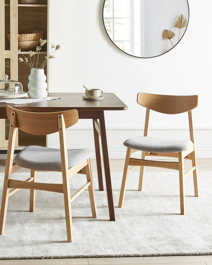 Scandinavian-style dining chair styled in a bright, airy dining setting with warm wood tones, minimalist décor, soft textiles, and neutral accents for a cozy modern-home aesthetic.