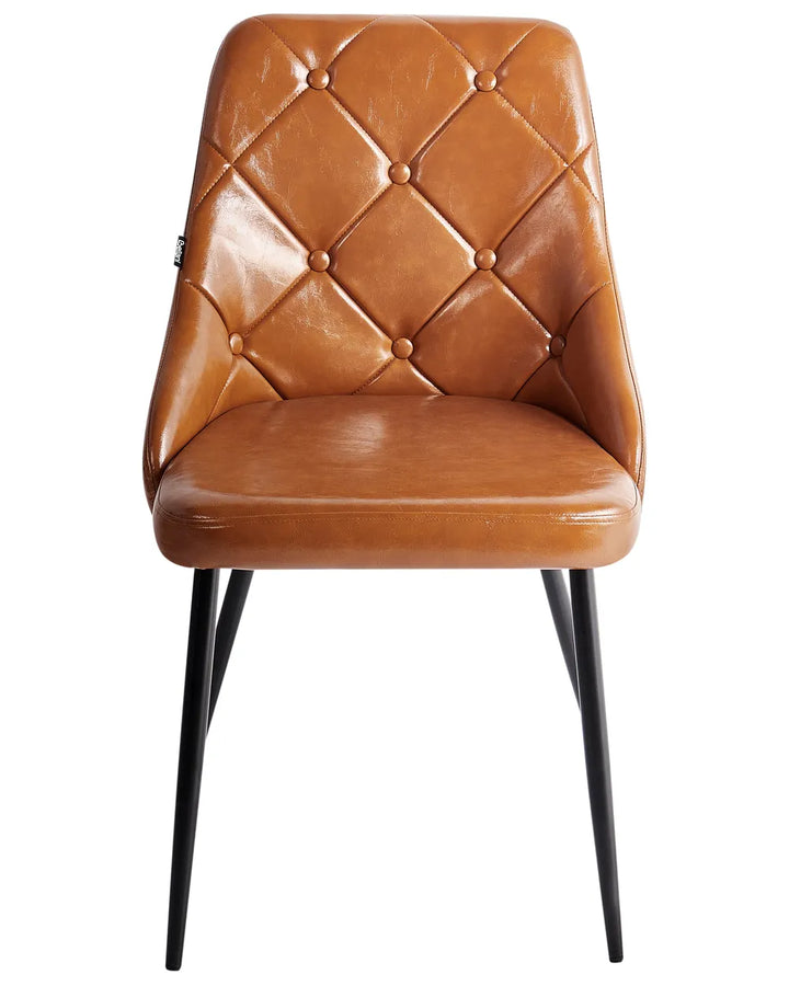 Caramel brown faux leather dining chair with diamond-tufted button detailing, a padded seat, and slim black metal legs for a refined vintage-inspired look.