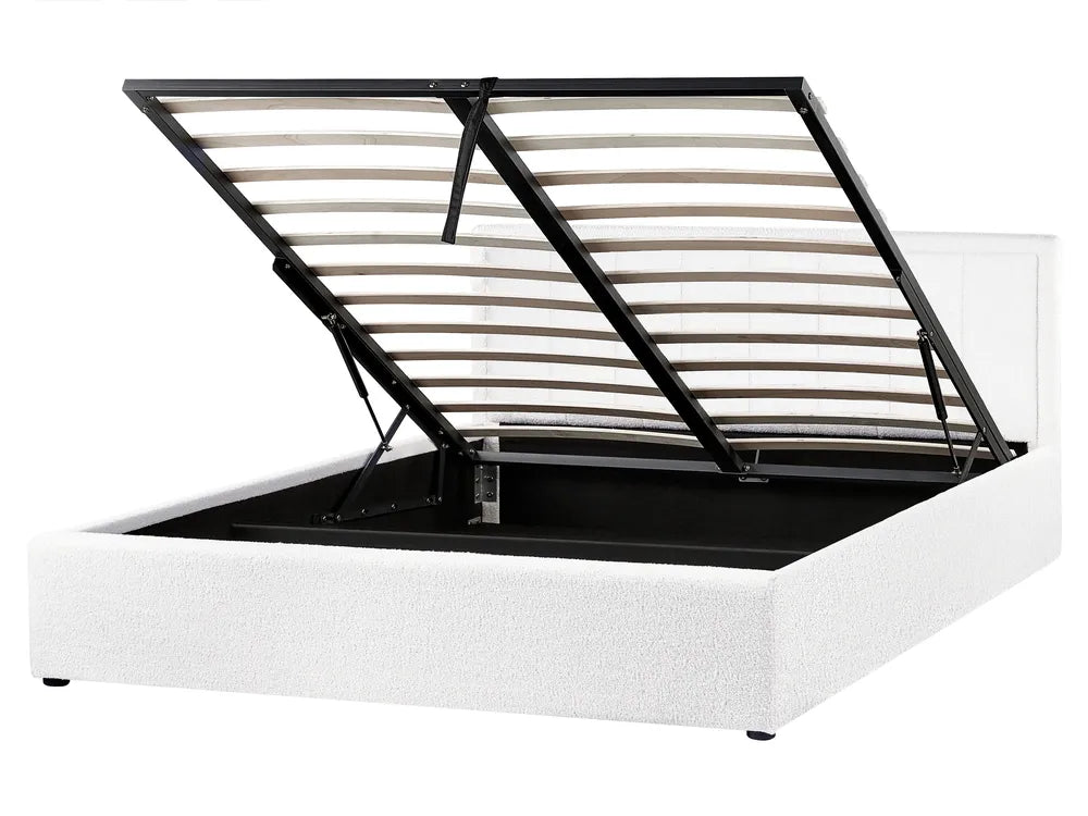 White bed frame with black metal slats on a white background
