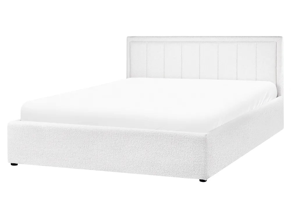 White bed with a headboard on a white background
