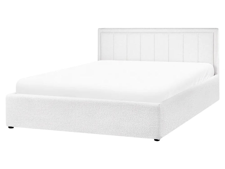 White bed with a headboard on a white background