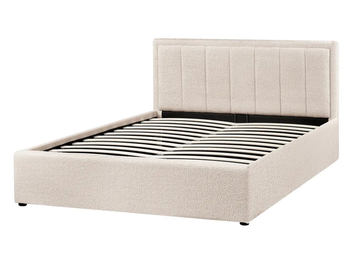 Beige upholstered bed frame on a white background