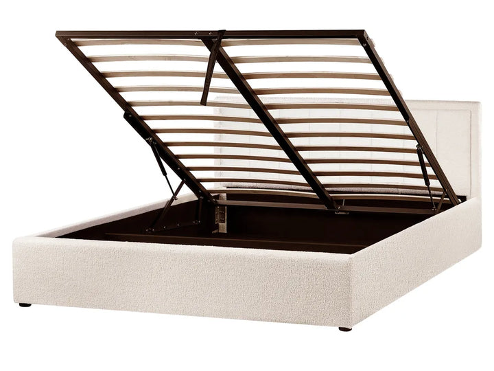 Bed frame with metal slats on a white background