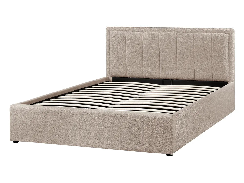 Beige upholstered bed frame on a white background