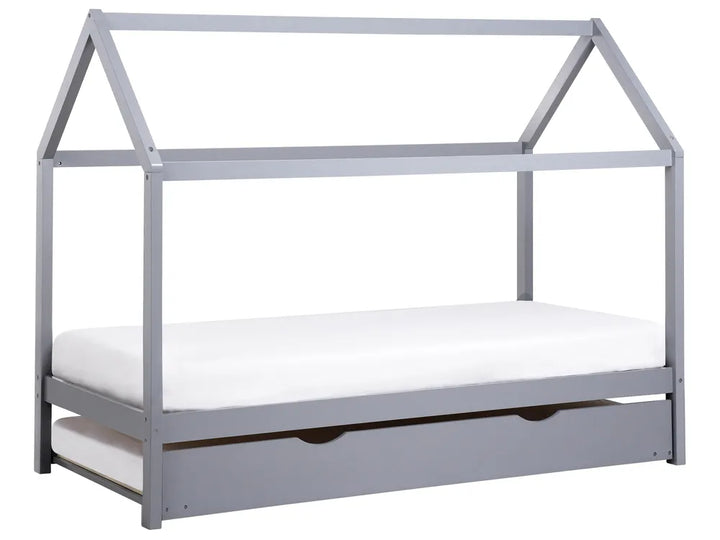 Gray children's bed with a white mattress on a white background