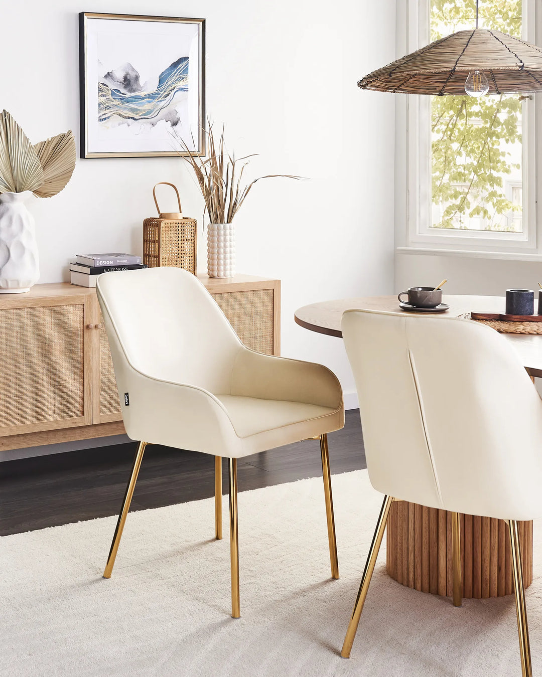 Contemporary dining space featuring cream dining chairs with gold accents, creating a bright, luxurious atmosphere that pairs beautifully with natural wood and warm-toned décor.