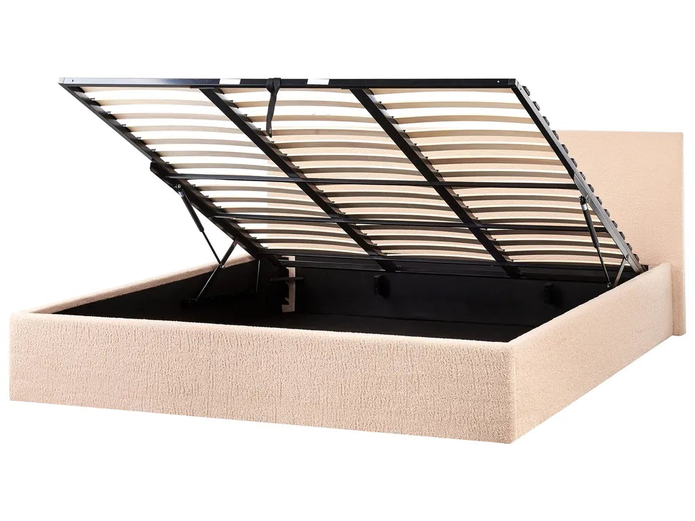 Beige upholstered bed frame with a black metal headboard 