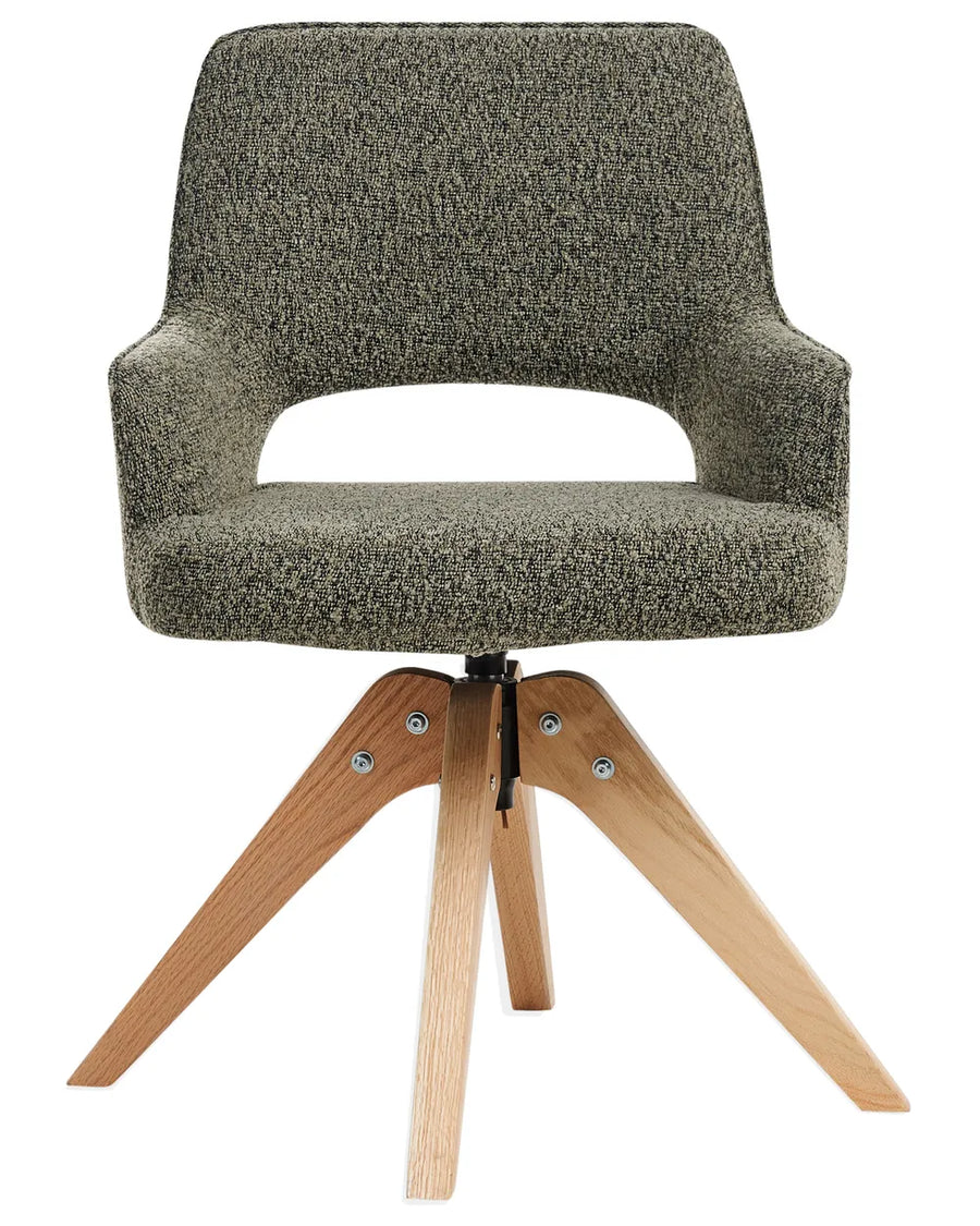 Grey bouclé swivel dining chair with integrated armrests and natural wood legs.