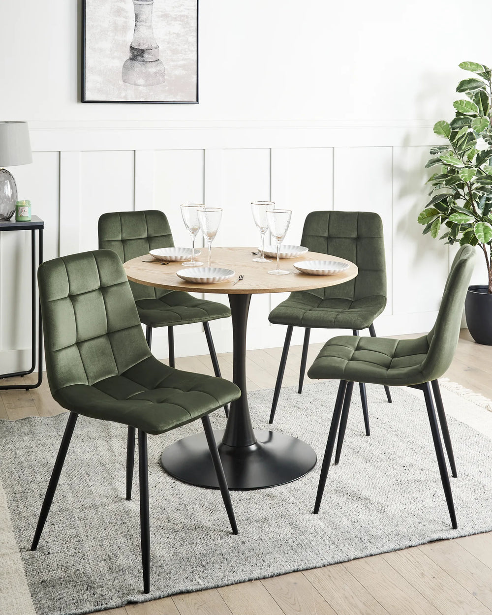 Contemporary dining setup featuring rich green velvet chairs that bring depth, comfort, and elegance to any dining space.