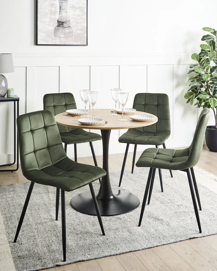 Contemporary dining setup featuring rich green velvet chairs that bring depth, comfort, and elegance to any dining space.
