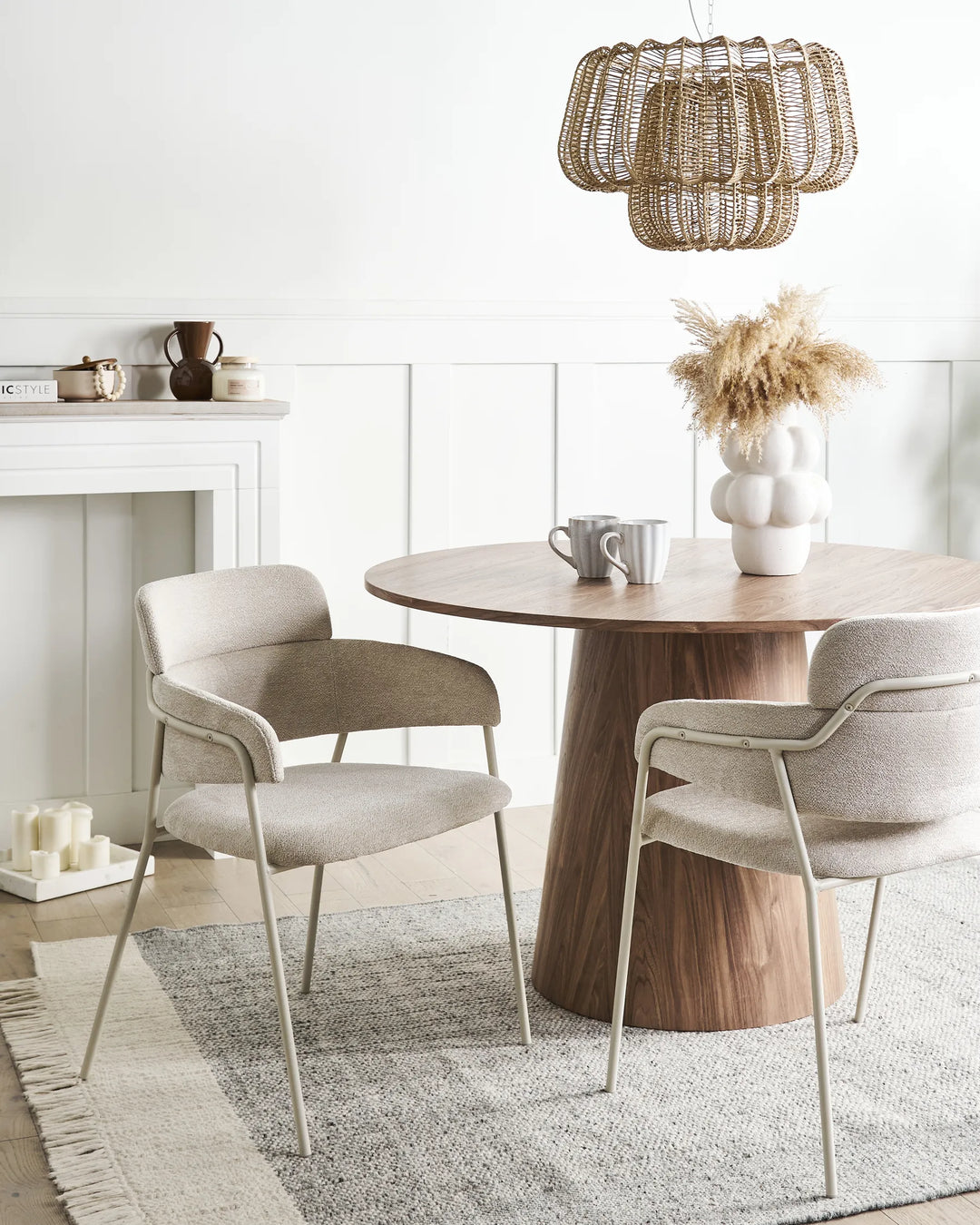 Cozy modern dining space featuring elegant bouclé chairs that bring warmth, comfort, and contemporary style.