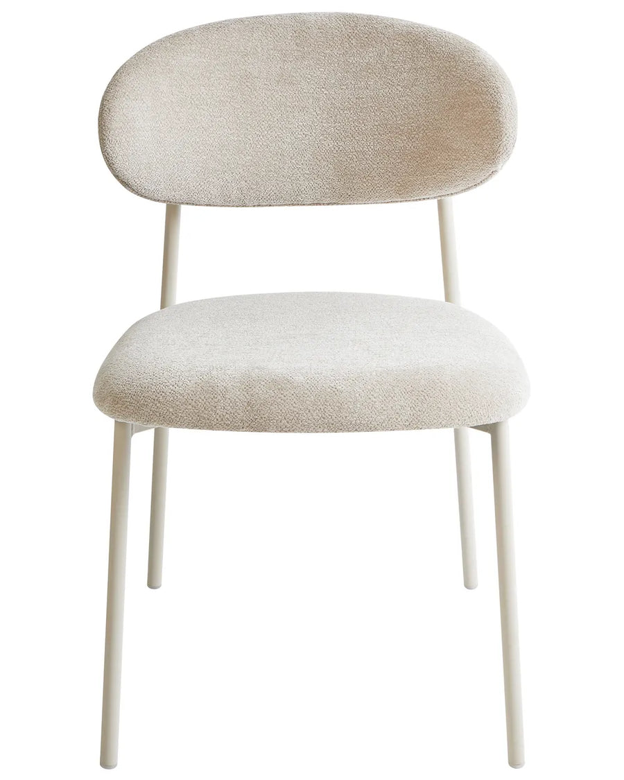 Cream bouclé dining chair with a rounded backrest, cushioned seat, and white metal legs.