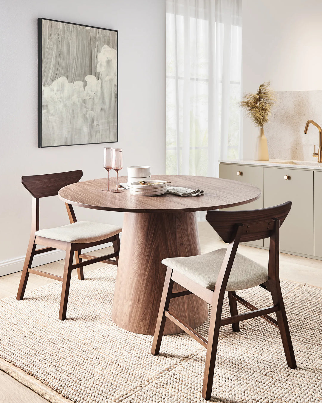 Featured in a contemporary dining setting, this walnut dining chair adds warmth and sophistication. The contrast between the rich wood frame and neutral upholstery creates an inviting and timeless look.