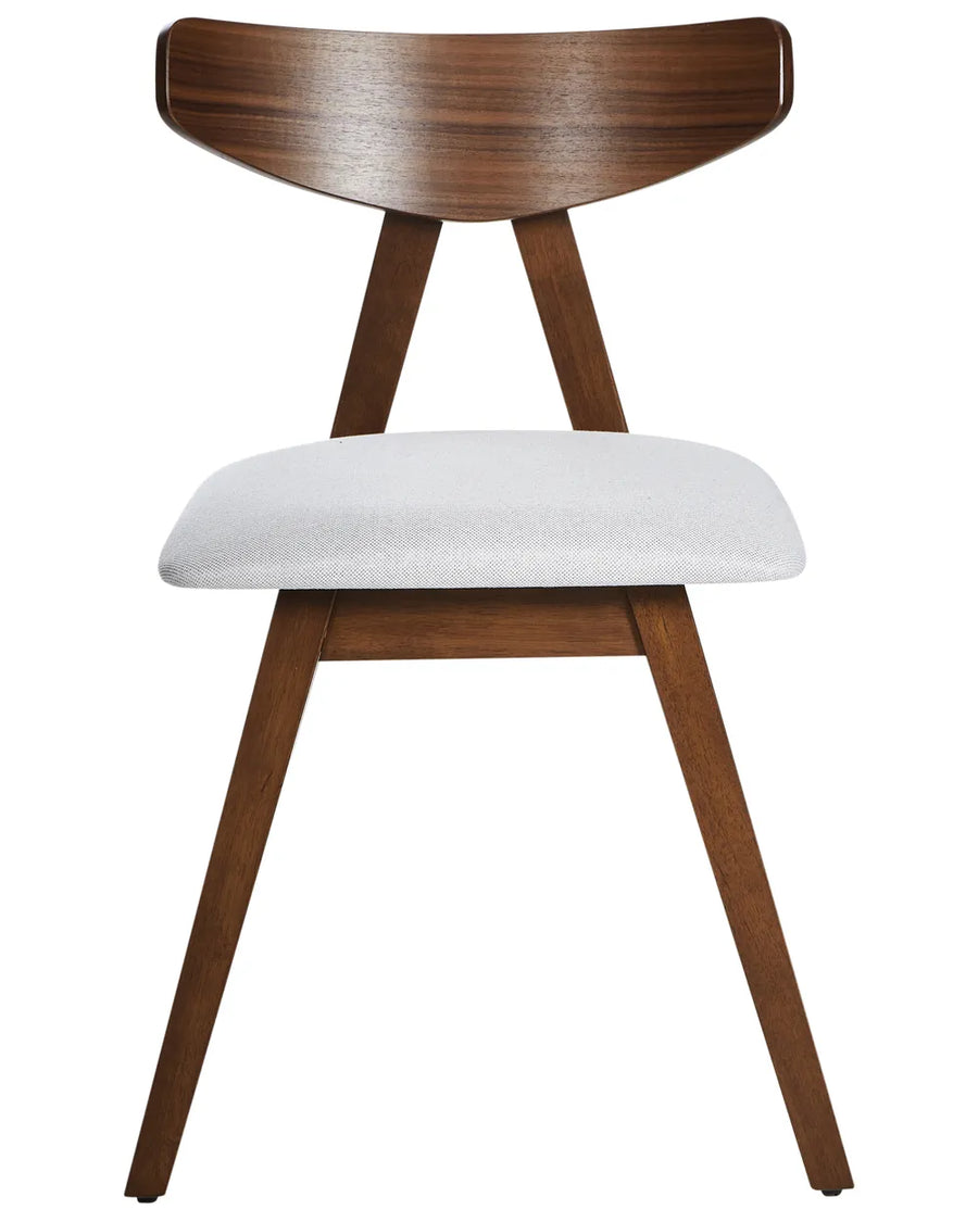 Contemporary dining chair featuring a distinctive curved wood backrest, solid dark walnut-effect frame, and a generously padded light grey upholstered seat. The angled A-frame construction creates a sleek architectural profile while offering reliable stability, ergonomic support, and everyday comfort.