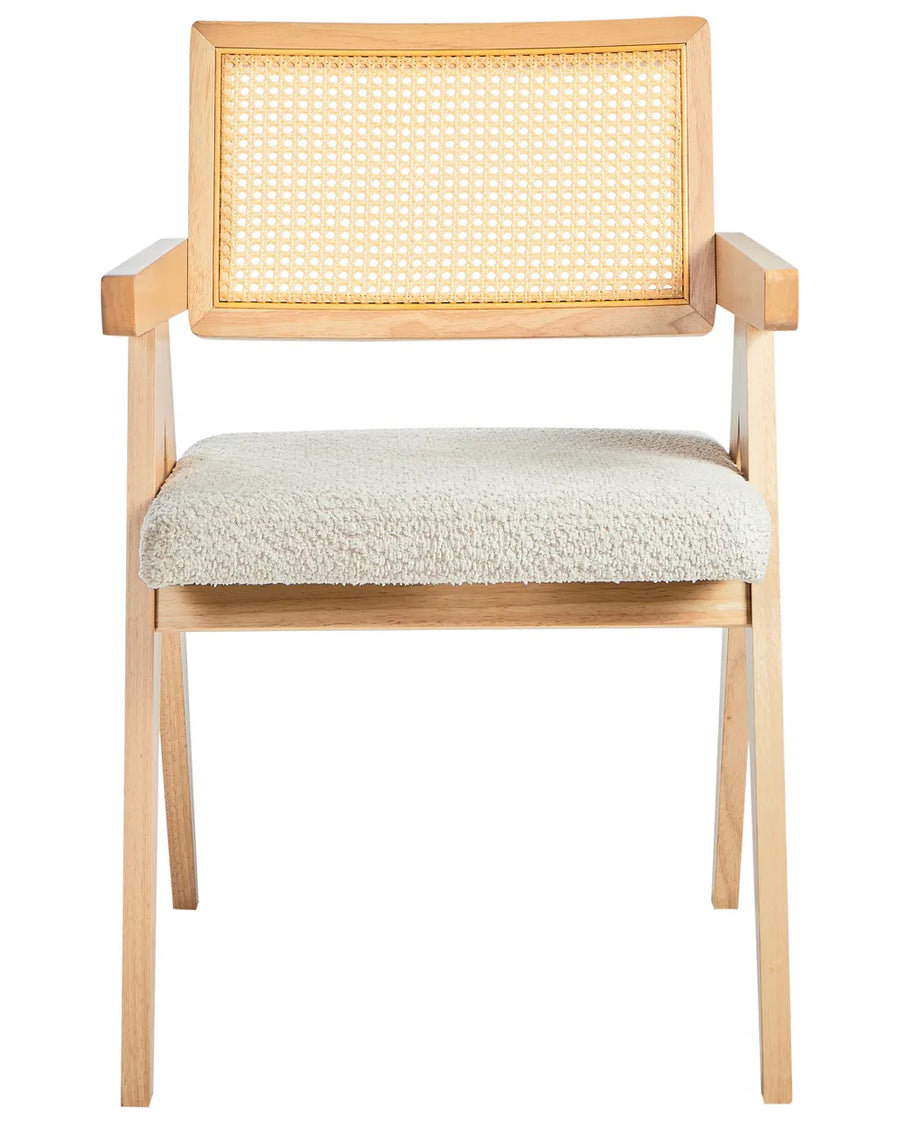 Light wood dining chair with woven cane backrest and cream boucle upholstered seat on a white background.