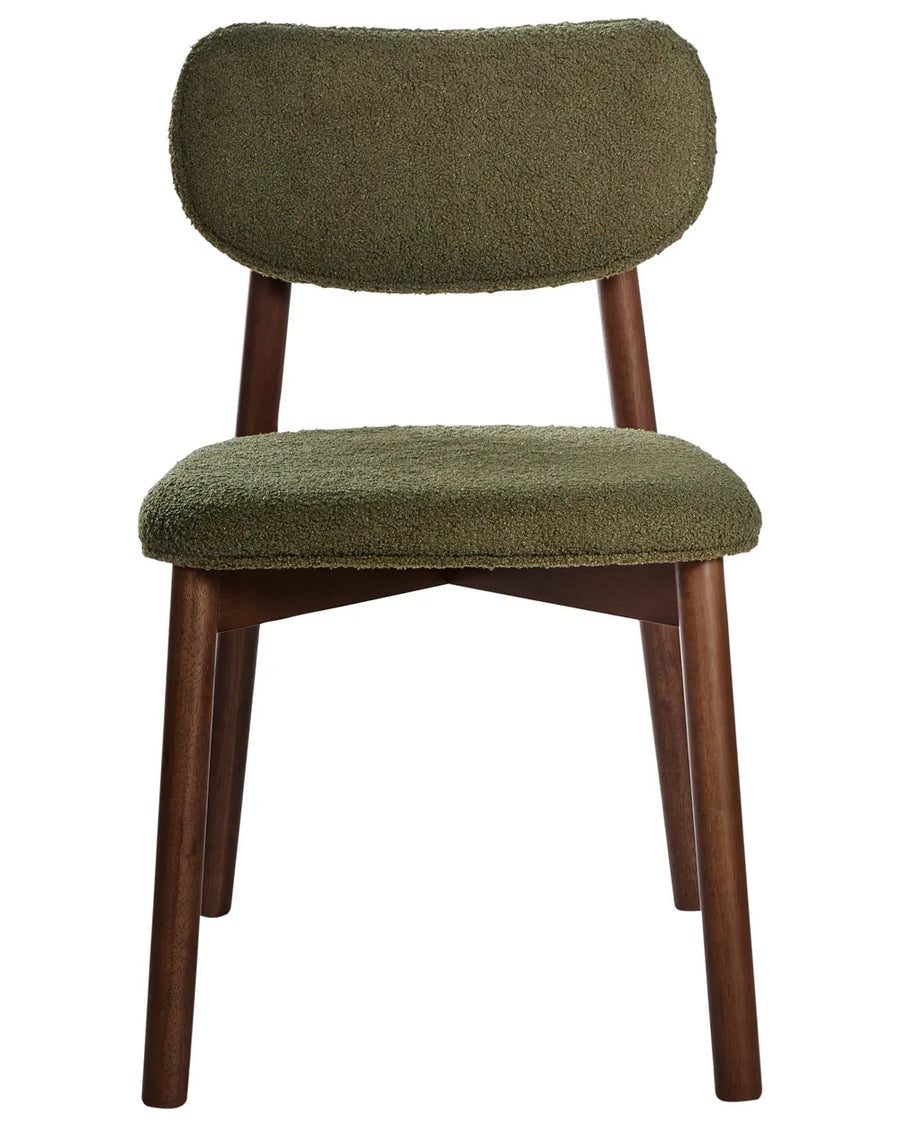 Bouclé dining chair with a curved backrest, padded seat, and dark wood frame, blending comfort with mid-century-inspired design.