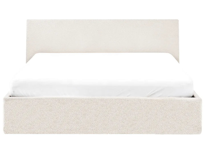 Beige upholstered bed frame with white mattress