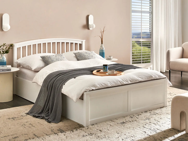 White wood bed frame with headboard and white mattress, clean white modern style.