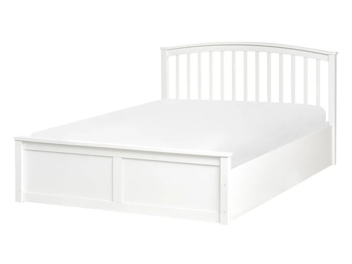 White bed frame with headboard and white mattress on a white background
