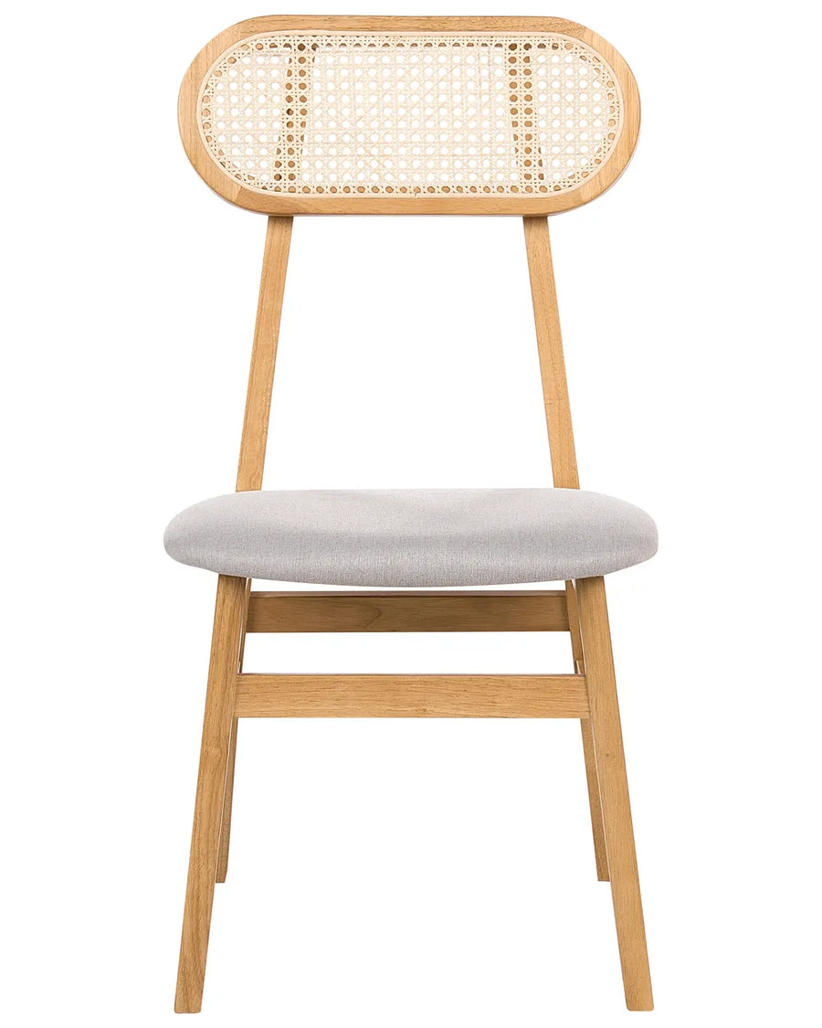 Natural wood dining chair with an oval cane backrest, soft light gray upholstered seat, and slim tapered legs, shown against a clean white background.