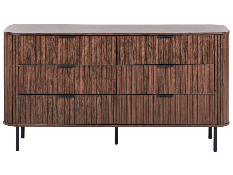 Wooden dresser with four drawers on a white background