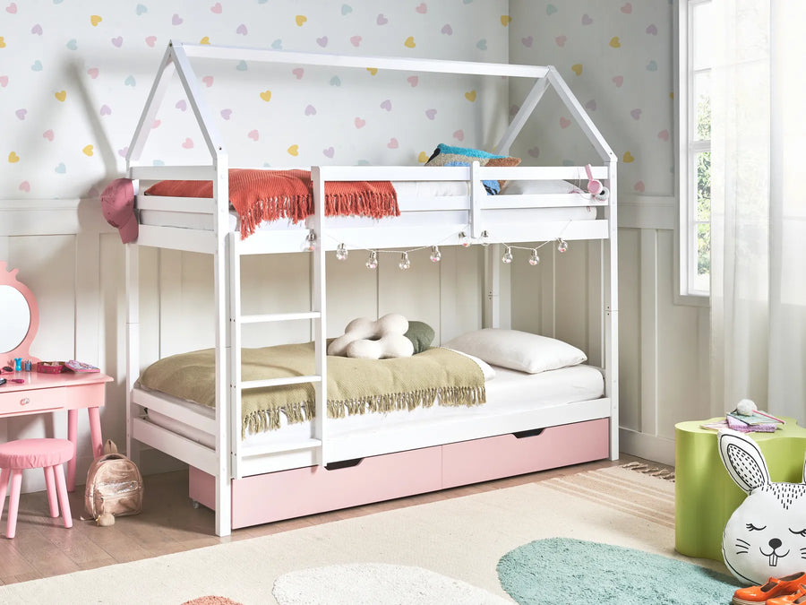 Children's room with a white house-shaped bed, pink drawers, and colorful decor.