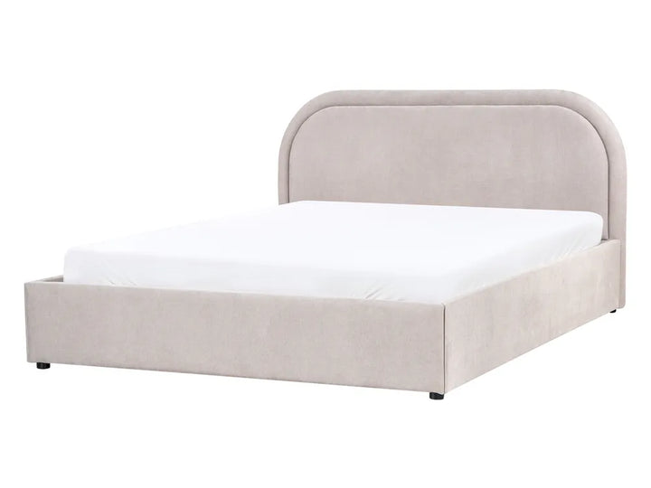 Beige upholstered bed with white mattress on a white background
