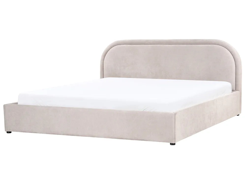 Beige upholstered bed with a white mattress on a white background