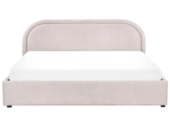 Beige upholstered bed with white mattress on a white background