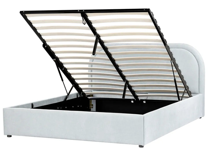 White bed frame with open storage compartment on a white background