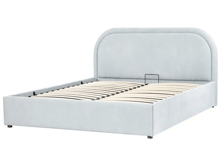 White upholstered bed frame with wooden slats on a white background