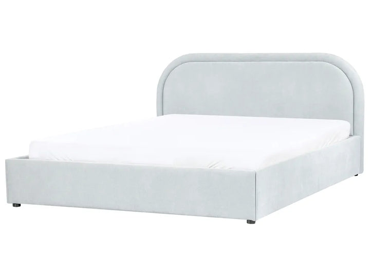 White bed frame with mattress on a white background