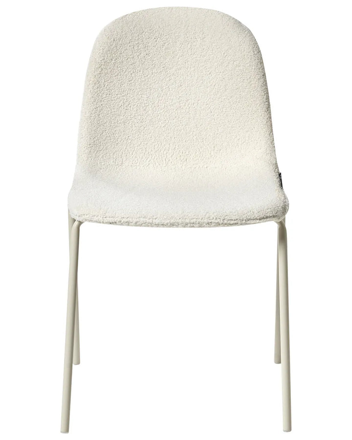 Bouclé dining chair in off-white with a curved shell seat and slim matching metal legs.