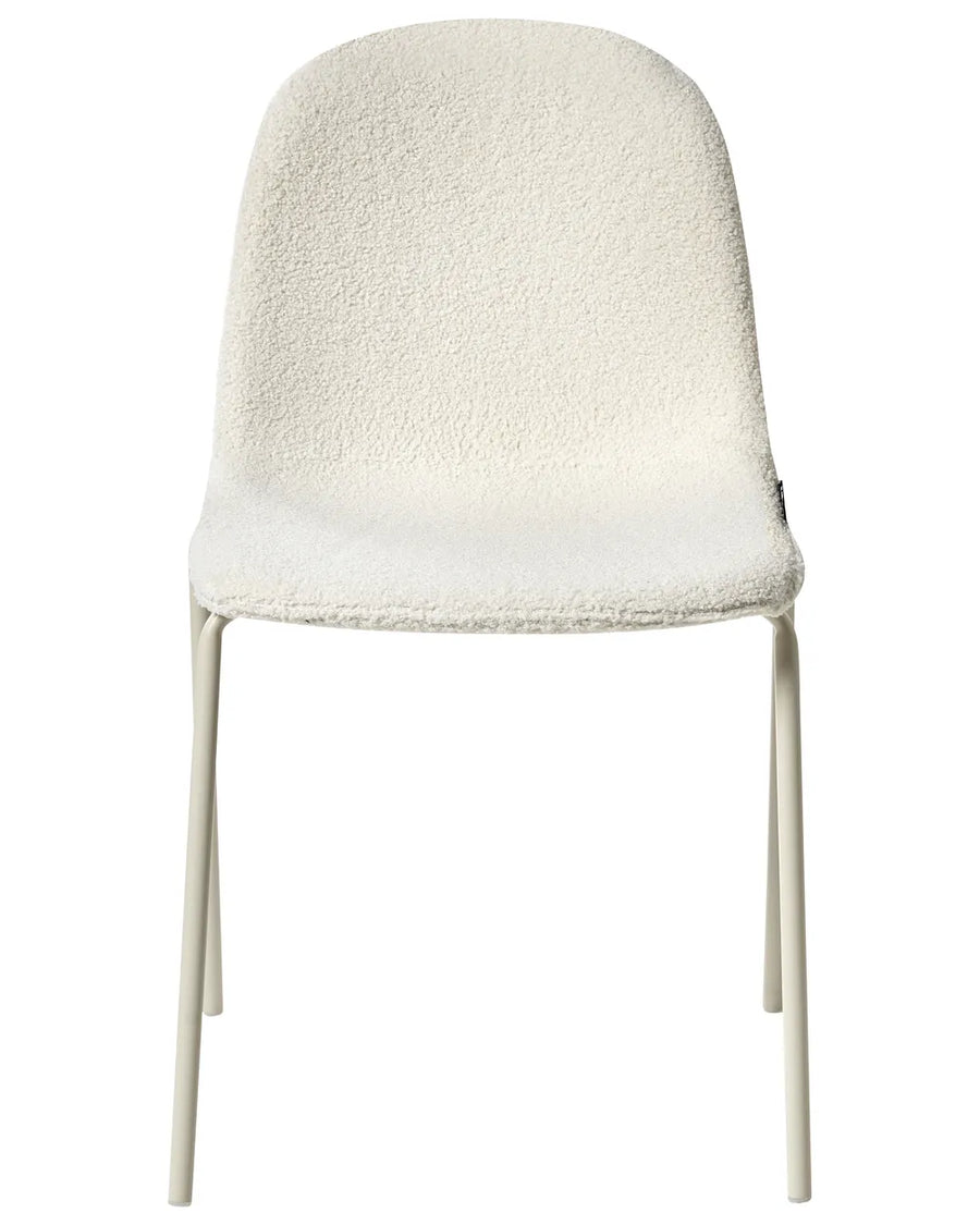 Bouclé dining chair in off-white with a curved shell seat and slim matching metal legs.