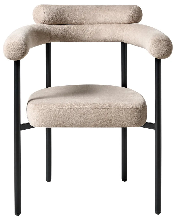 Beige fabric dining chair with a wide rounded backrest, padded seat with integrated armrests, and slim black iron legs.