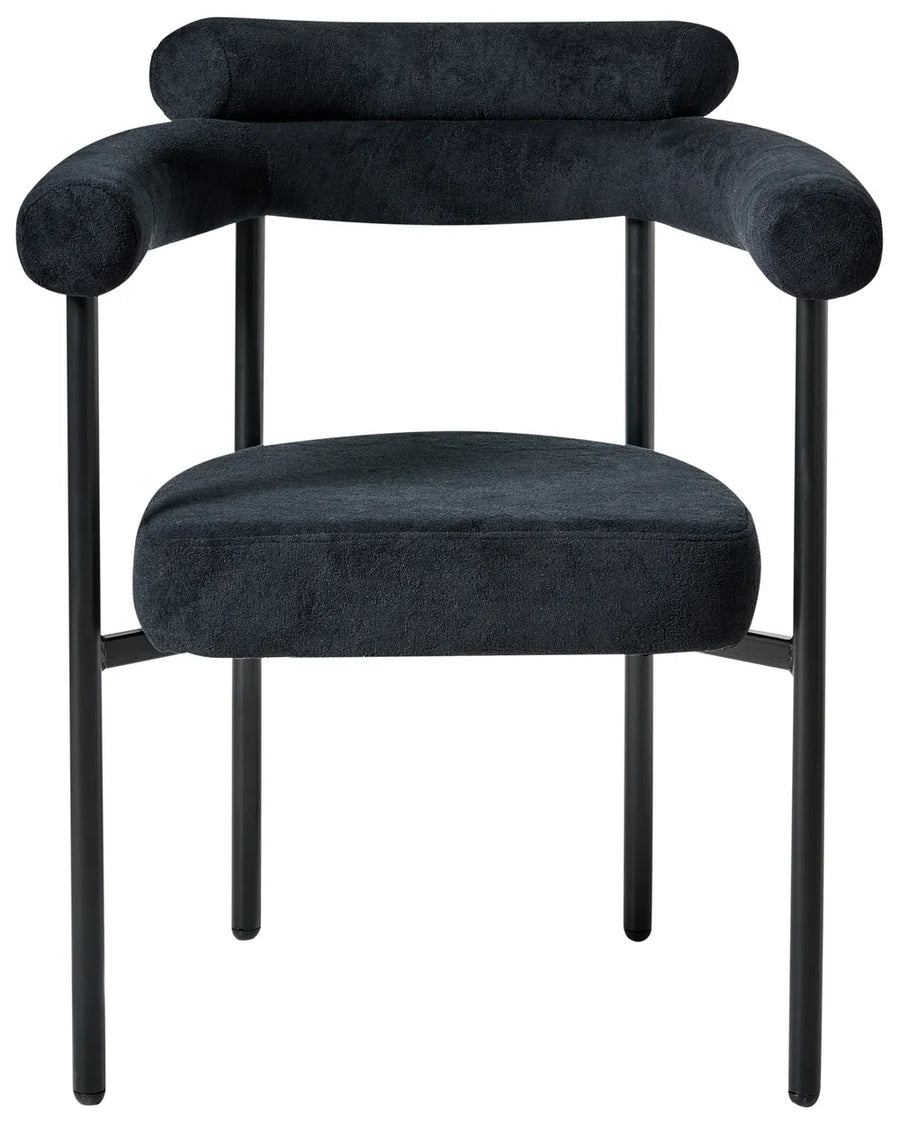 Black fabric dining chair with a wide rounded backrest, padded seat with integrated armrests, and slim black iron legs.