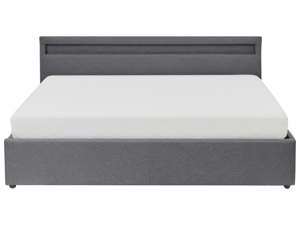 Gray upholstered bed with white mattress on a white background
